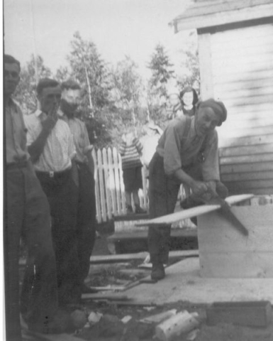 544: Foreground left-to-right, Mike Rose, Jer Rose, Stan Bonia, Peter Bonia (sawing); in background  children unidentified and Sade (Bonia) Rose. At Pasadena. (circa 1946) [courtesy of Stan Bonia]  - Mike &amp;amp; Jer sons of William Rose &amp;amp; Emma Withers; Peter son of John Bonia &amp;amp;  Honorah Viscount, married Veronica Carroll; Stan and Sade children of Peter Bonia &amp;amp; Veronica Carroll